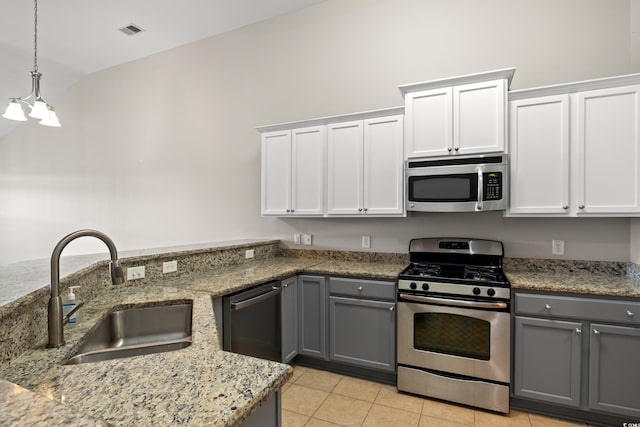 121 Parmelee Dr Unit D, Murrells Inlet, SC 29576 - kitchen featuring stainless steel appliances, a sink, gray cabinetry, light tile patterned flooring, and pendant lighting