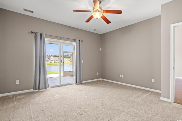 121 Parmelee Dr Unit D, Murrells Inlet, SC 29576 - carpeted spare room with a ceiling fan, baseboards, and a water view