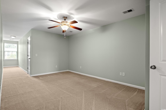 121 Parmelee Dr Unit D, Murrells Inlet, SC 29576 - empty room featuring light carpet, a ceiling fan, and baseboards