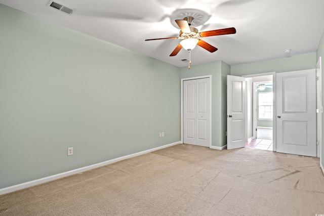 121 Parmelee Dr Unit D, Murrells Inlet, SC 29576 - unfurnished bedroom with light colored carpet, baseboards, a closet, and ceiling fan