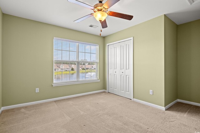 121 Parmelee Dr Unit D, Murrells Inlet, SC 29576 - unfurnished bedroom featuring carpet, baseboards, and a closet