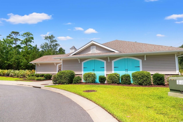 121 Parmelee Dr Unit D, Murrells Inlet, SC 29576 - view of front of house with a front yard and a shingled roof