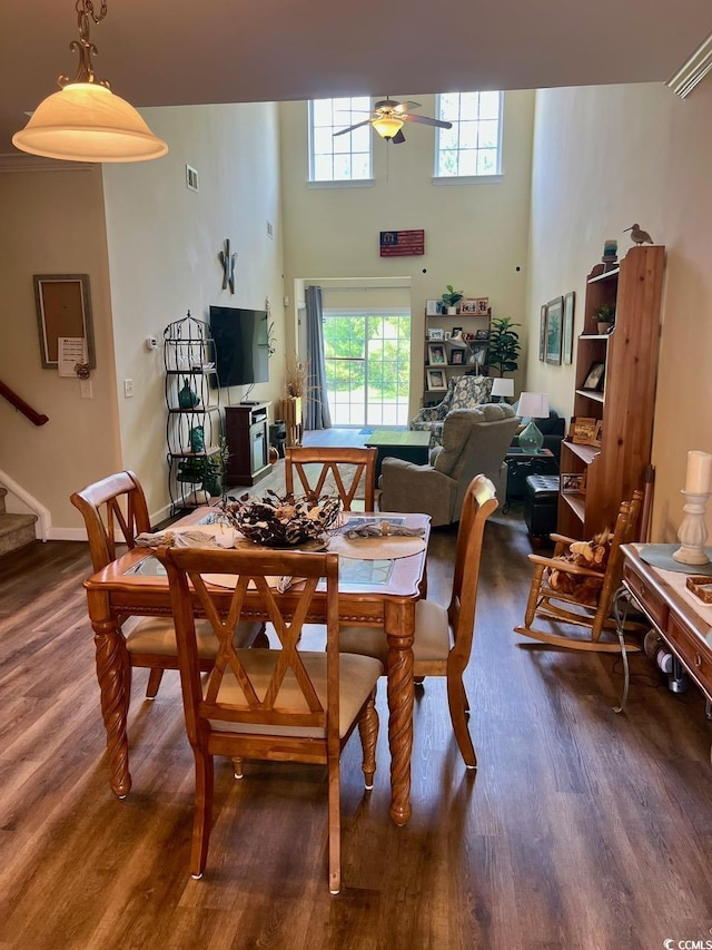 1048 Fairway Ln Unit 1048, Conway, SC 29526 - dining space featuring wood finished floors, a ceiling fan, healthy amount of natural light, stairway, and a high ceiling