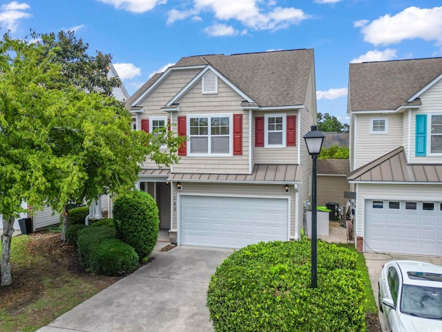 185 Fulbourn Pl, Myrtle Beach, SC 29579 - view of front of property with a garage, concrete driveway, a shingled roof, and a standing seam roof