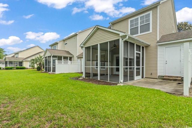 185 Fulbourn Pl, Myrtle Beach, SC 29579 - rear view of property featuring a sunroom, a lawn, ceiling fan, and a patio area