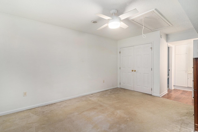 157 Egret Run Ln Unit 523, Pawleys Island, SC 29585 - unfurnished bedroom with attic access, light colored carpet, a closet, and ceiling fan
