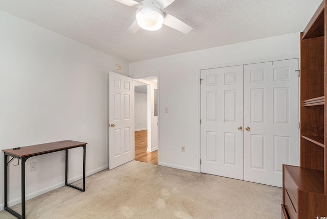 157 Egret Run Ln Unit 523, Pawleys Island, SC 29585 - unfurnished bedroom with light carpet, a closet, and ceiling fan