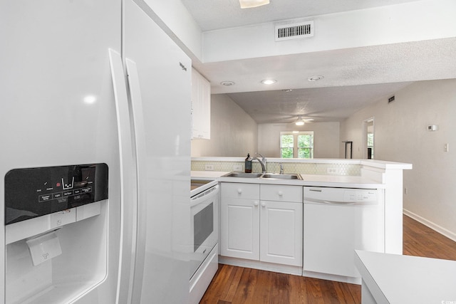 157 Egret Run Ln Unit 523, Pawleys Island, SC 29585 - kitchen featuring white appliances, a peninsula, a ceiling fan, and dark wood-style flooring