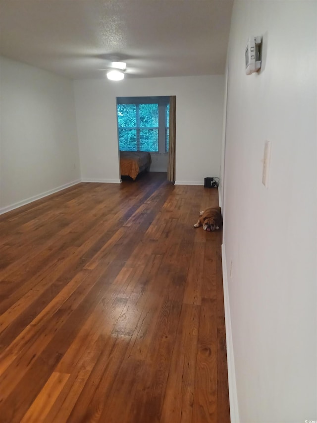 157 Egret Run Ln Unit 523, Pawleys Island, SC 29585 - empty room with dark wood-style floors and baseboards