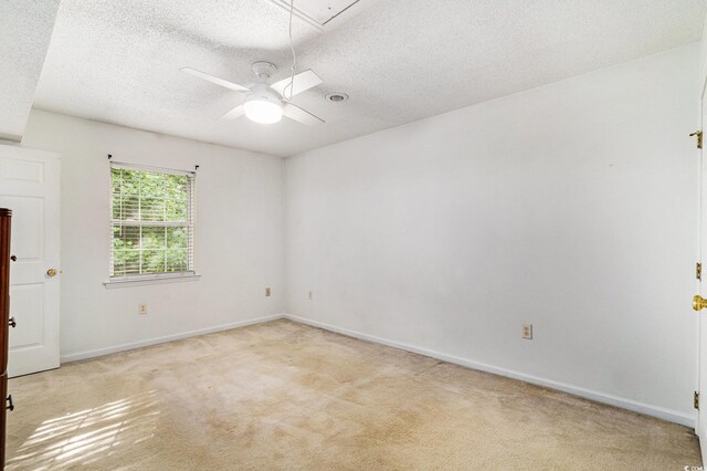 157 Egret Run Ln Unit 523, Pawleys Island, SC 29585 - unfurnished room with a textured ceiling, light colored carpet, ceiling fan, and attic access