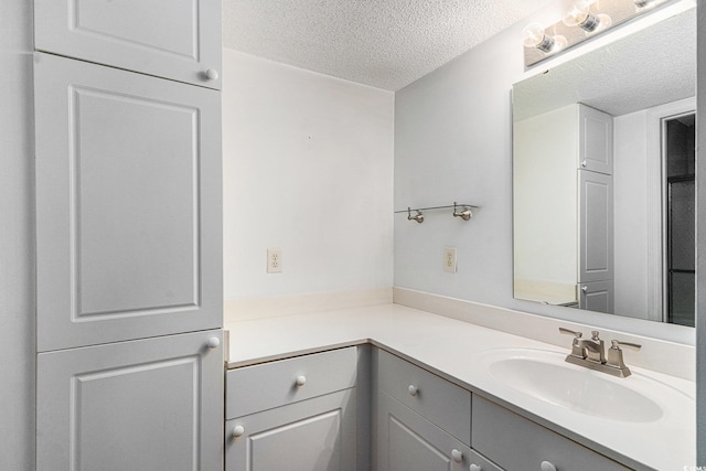 157 Egret Run Ln Unit 523, Pawleys Island, SC 29585 - bathroom featuring a textured ceiling and vanity