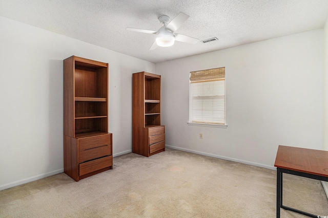 157 Egret Run Ln Unit 523, Pawleys Island, SC 29585 - unfurnished bedroom featuring light carpet, a textured ceiling, and a ceiling fan