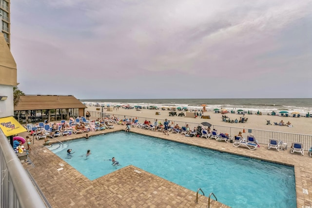 9550 Shore Dr Unit 1418, Myrtle Beach, SC 29572 - community pool featuring a water view and a patio area