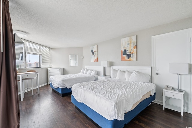 9550 Shore Dr Unit 1418, Myrtle Beach, SC 29572 - bedroom featuring a textured ceiling, wood finished floors, and baseboards