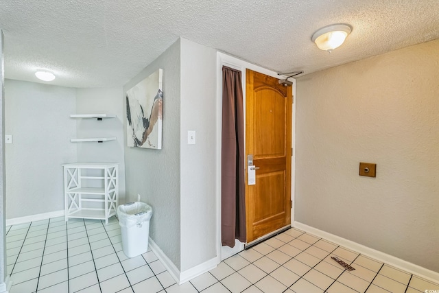 9550 Shore Dr Unit 1418, Myrtle Beach, SC 29572 - corridor featuring a textured ceiling, light tile patterned flooring, baseboards, and a textured wall