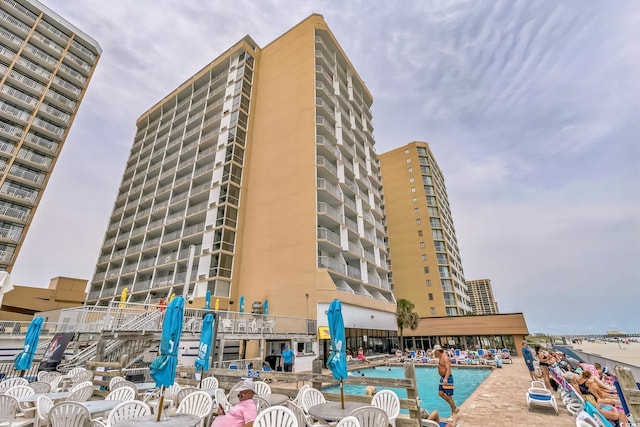 9550 Shore Dr Unit 1418, Myrtle Beach, SC 29572 - view of building exterior featuring a community pool and a water view