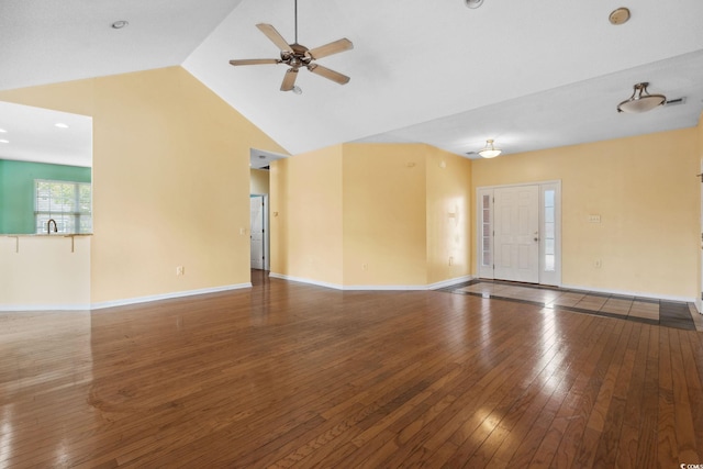 2384 Covington Dr, Myrtle Beach, SC 29579 - unfurnished living room featuring ceiling fan, hardwood / wood-style floors, vaulted ceiling, baseboards, and a sink