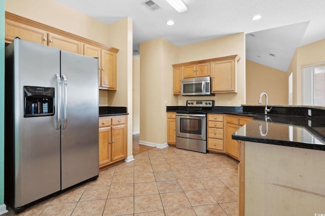 2384 Covington Dr, Myrtle Beach, SC 29579 - kitchen with appliances with stainless steel finishes, a sink, a peninsula, light brown cabinetry, and vaulted ceiling