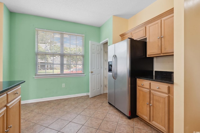 2384 Covington Dr, Myrtle Beach, SC 29579 - kitchen featuring stainless steel fridge, light tile patterned flooring, and baseboards