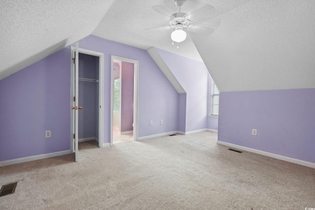 2384 Covington Dr, Myrtle Beach, SC 29579 - bonus room featuring a textured ceiling, carpet, a ceiling fan, lofted ceiling, and baseboards
