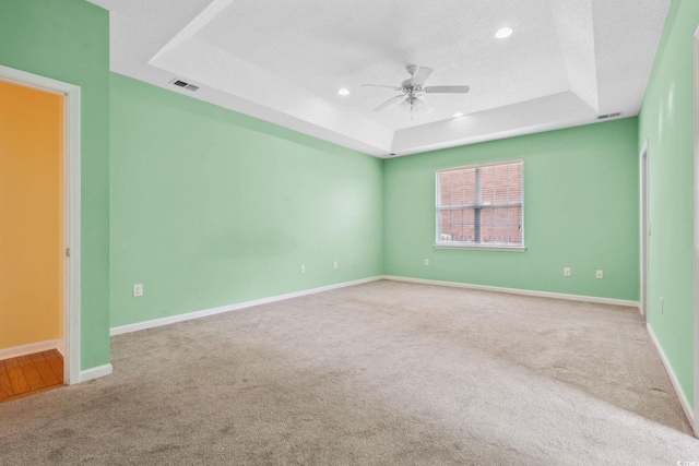 2384 Covington Dr, Myrtle Beach, SC 29579 - empty room with a tray ceiling, a ceiling fan, carpet floors, recessed lighting, and baseboards