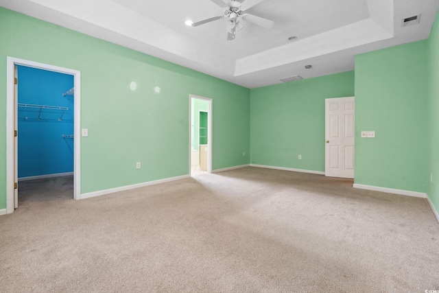 2384 Covington Dr, Myrtle Beach, SC 29579 - unfurnished room featuring carpet, baseboards, ceiling fan, and a raised ceiling