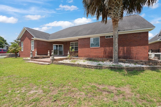 2384 Covington Dr, Myrtle Beach, SC 29579 - back of property with brick siding, a patio area, and a shingled roof