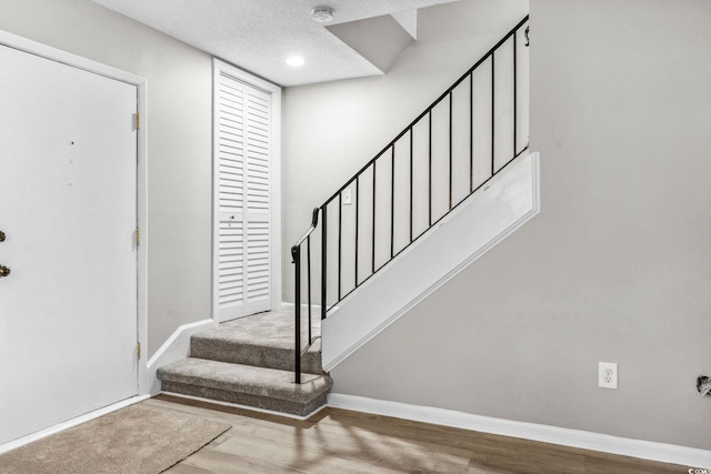 315 73rd Ave N Unit 2, Myrtle Beach, SC 29572 - entrance foyer with stairway, wood finished floors, and a textured ceiling