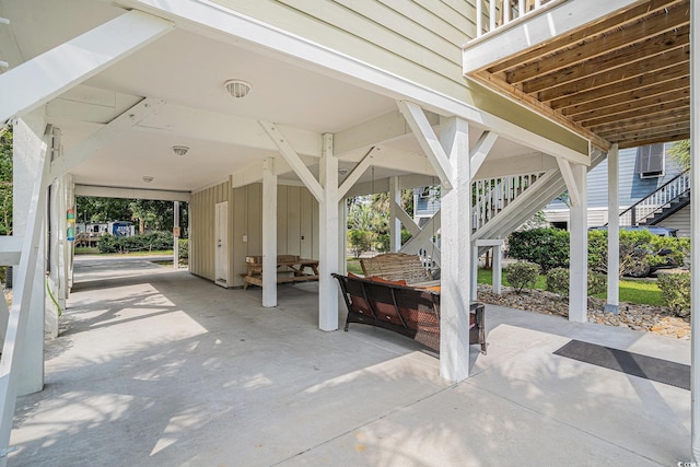 58 Fathom Ln, Murrells Inlet, SC 29576 - view of patio featuring stairs, a carport, and driveway