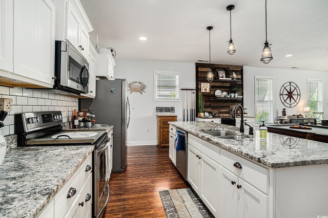 58 Fathom Ln, Murrells Inlet, SC 29576 - kitchen with appliances with stainless steel finishes, a sink, plenty of natural light, tasteful backsplash, and recessed lighting
