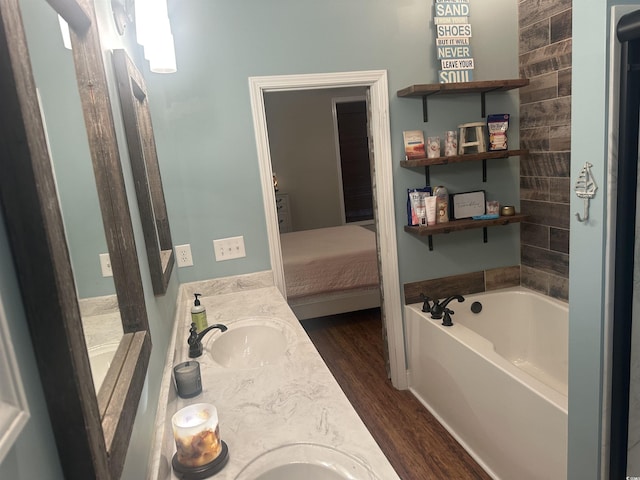 58 Fathom Ln, Murrells Inlet, SC 29576 - bathroom featuring double vanity, a bath, wood finished floors, and ensuite bath
