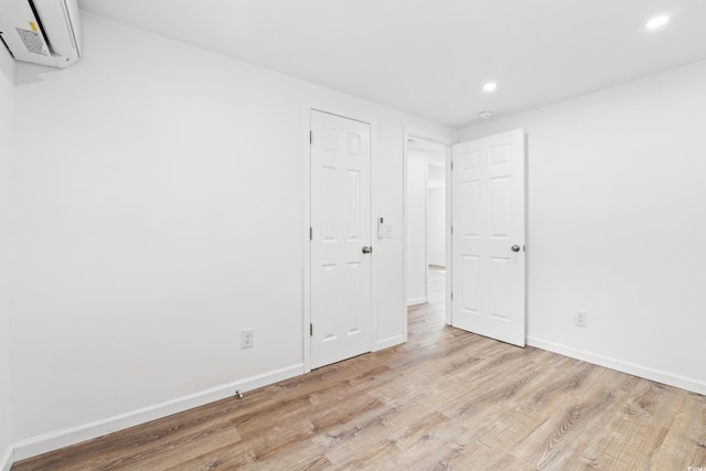 1004 Georgetown St, Marion, SC 29571 - empty room featuring recessed lighting, wood finished floors, a wall mounted AC, and baseboards