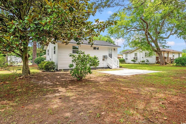 1004 Georgetown St, Marion, SC 29571 - back of house with a patio and a lawn