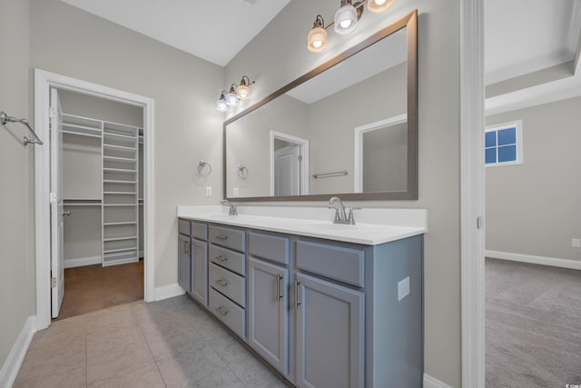 2080 Silver Island Way, Murrells Inlet, SC 29576 - bathroom featuring double vanity, baseboards, a spacious closet, and tile patterned flooring