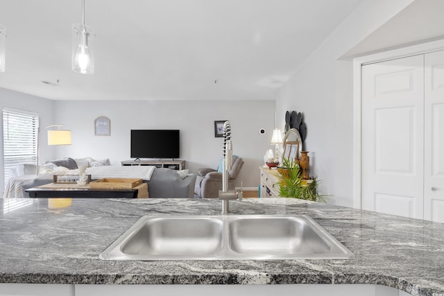 1101 Possum Trot Rd Unit D201, North Myrtle Beach, SC 29582 - kitchen featuring pendant lighting, open floor plan, and dark countertops