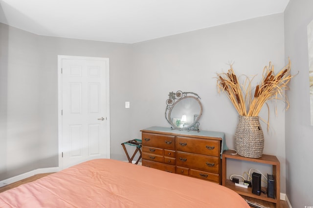 1101 Possum Trot Rd Unit D201, North Myrtle Beach, SC 29582 - bedroom with baseboards and wood finished floors