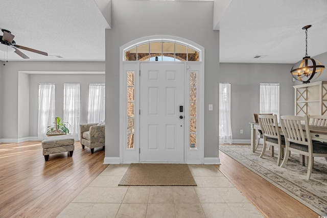 4232 Pointer Ct, Myrtle Beach, SC 29579 - foyer entrance featuring a chandelier, ceiling fan, light wood-style floors, and baseboards