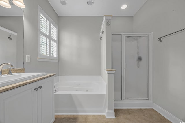 4232 Pointer Ct, Myrtle Beach, SC 29579 - bathroom featuring a shower stall, vanity, a bath, and baseboards