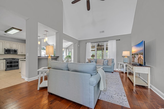 4232 Pointer Ct, Myrtle Beach, SC 29579 - living area featuring light wood-style floors, ceiling fan, baseboards, and high vaulted ceiling