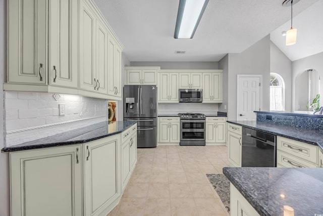 4232 Pointer Ct, Myrtle Beach, SC 29579 - kitchen with appliances with stainless steel finishes, decorative backsplash, light tile patterned floors, hanging light fixtures, and lofted ceiling