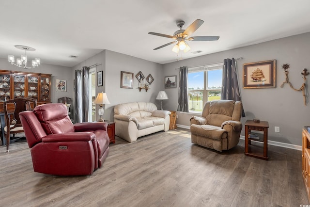 568 Mossbank Loop, Longs, SC 29568 - living area featuring a chandelier, wood finished floors, and ceiling fan