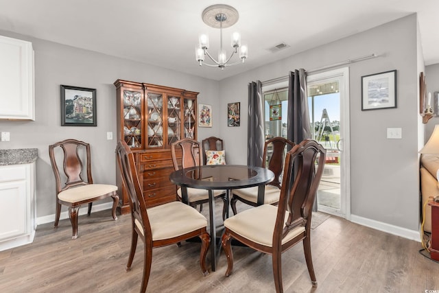 568 Mossbank Loop, Longs, SC 29568 - dining room with a chandelier and light wood finished floors