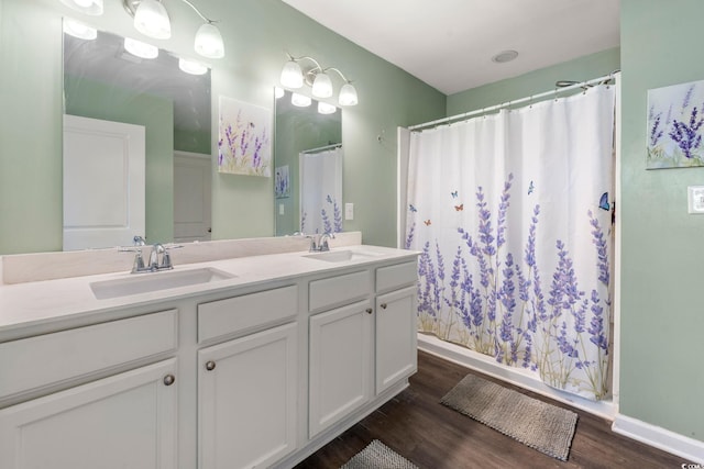 568 Mossbank Loop, Longs, SC 29568 - full bathroom with double vanity, wood finished floors, and curtained shower