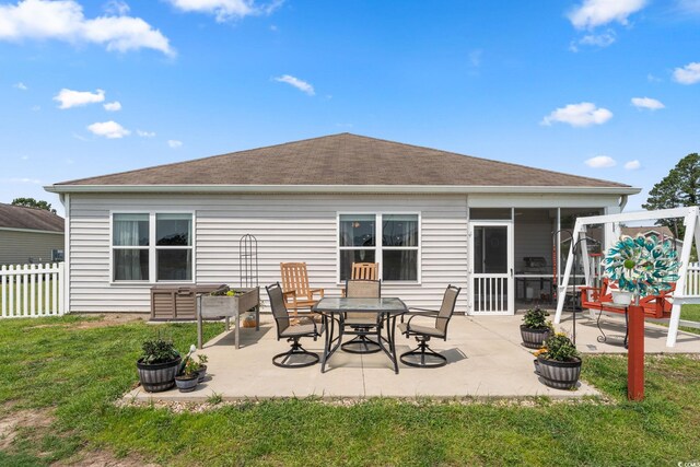 568 Mossbank Loop, Longs, SC 29568 - rear view of property featuring a patio area, a sunroom, and roof with shingles