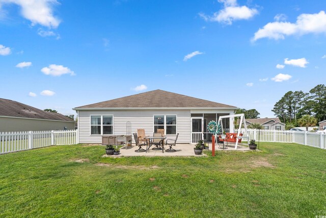 568 Mossbank Loop, Longs, SC 29568 - rear view of property with a patio area, a fenced backyard, and a shingled roof