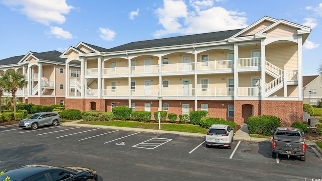 3983 Forsythia Ct Unit 301, Myrtle Beach, SC 29588 - view of building exterior with uncovered parking