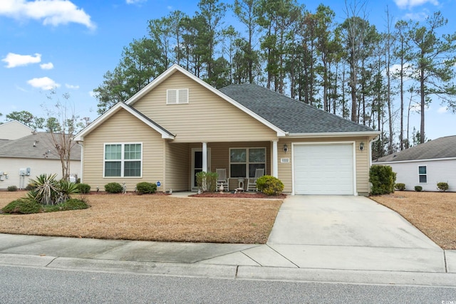 1222 Midtown Village Dr, Conway, SC 29526 - view of front of property with a porch, a garage, driveway, a front lawn, and roof with shingles