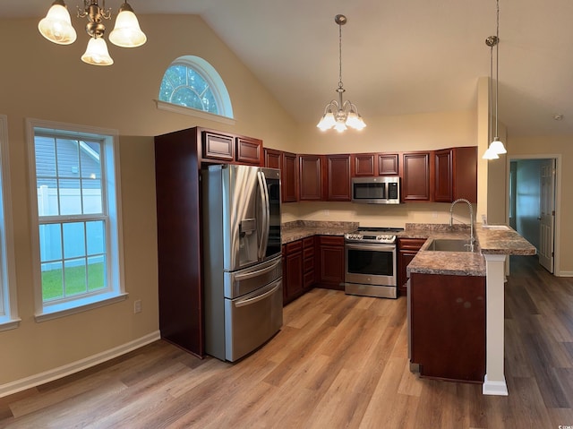 753 Bucklin Loop, Myrtle Beach, SC 29579 - kitchen with stainless steel appliances, a chandelier, a peninsula, high vaulted ceiling, and light wood finished floors