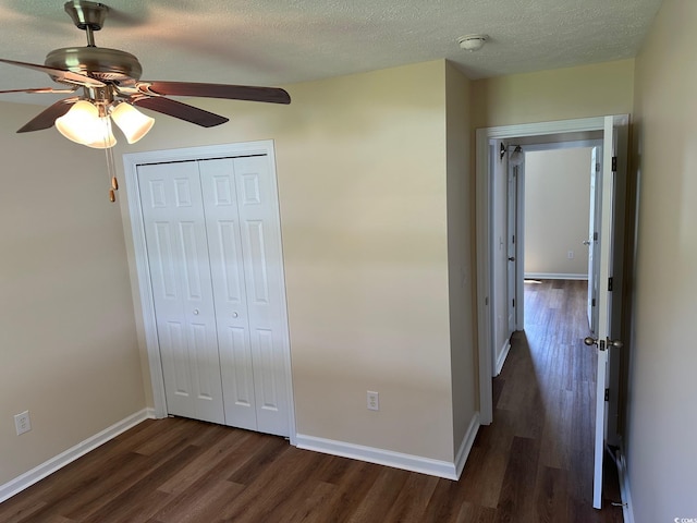 753 Bucklin Loop, Myrtle Beach, SC 29579 - unfurnished bedroom with dark wood-type flooring, a closet, a textured ceiling, and a ceiling fan