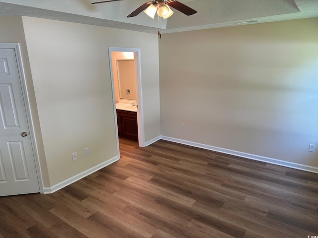 753 Bucklin Loop, Myrtle Beach, SC 29579 - unfurnished bedroom featuring dark wood-style flooring, ensuite bathroom, and a ceiling fan